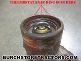 Thermostat snap ring placement